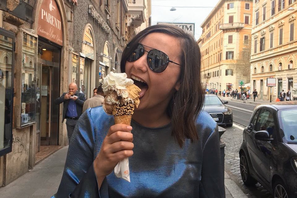 TrovaTrip Traveler eating gelato in Italy.