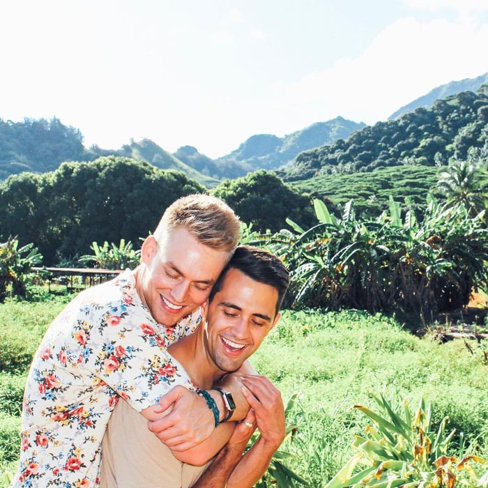 TrovaTrip two travelers embracing in lush forest