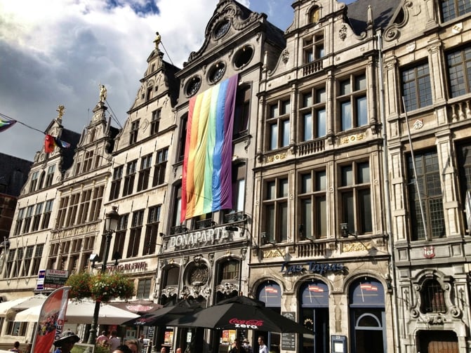 TrovaTrip BonaParte hotel with cloudy sky above and pride flag displayed on the windows