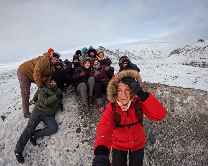 TrovaTrip Iceland Travelers pose in the snow.