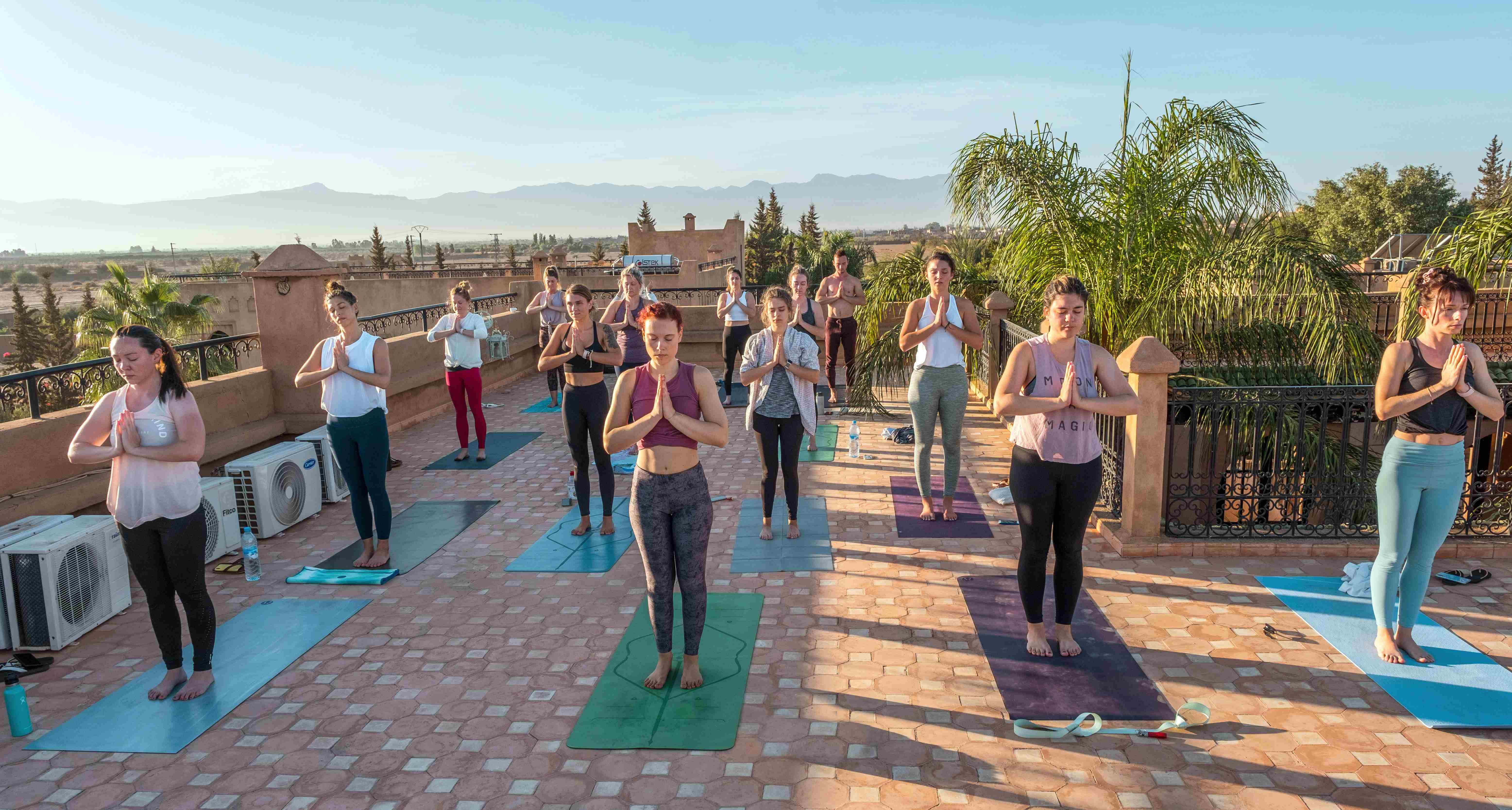 TrovaTrip yoga retreat on a rooftop in Morocco lead by Chelsea Hofer @chelseasyoga.