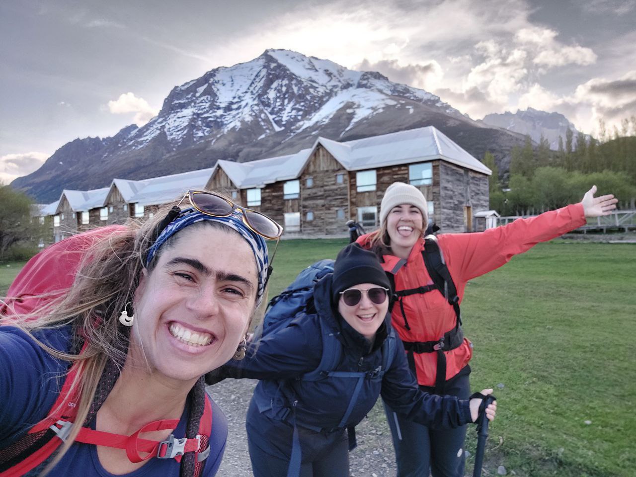 Pilar, a hiking Guide in Patagonia, with Travelers enjoying each other's company while hiking on a group women's trip.