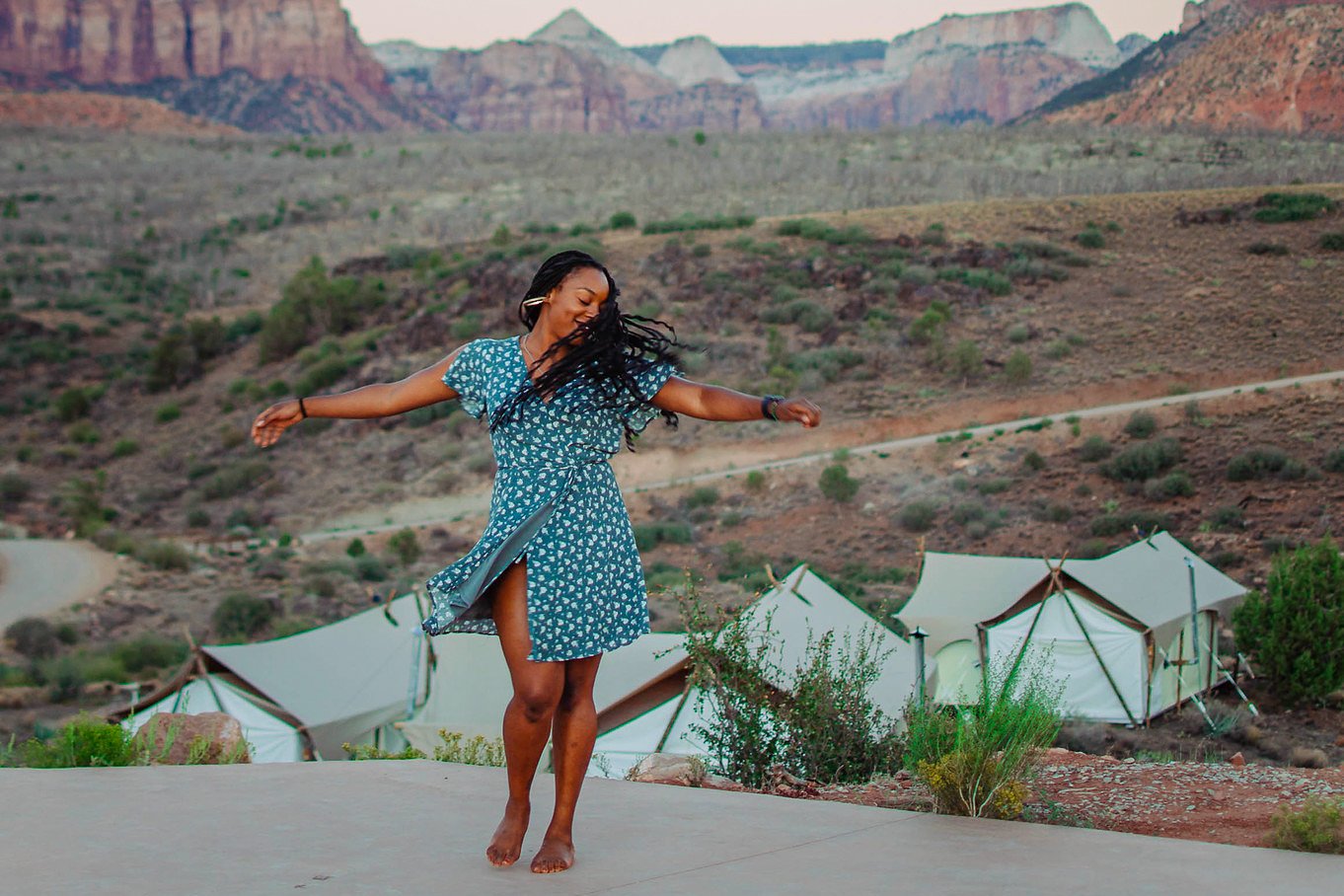 Woman dancing in Zion with TrovaTrip.