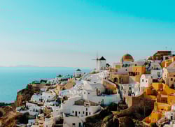 TrovaTrip Greece view of city with ocean in background