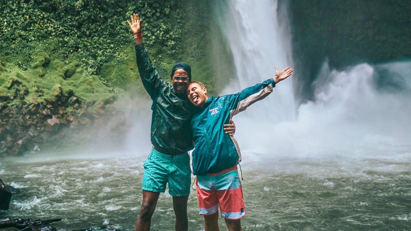 Couple near waterfall in Costa Rica on a TrovaTrip.