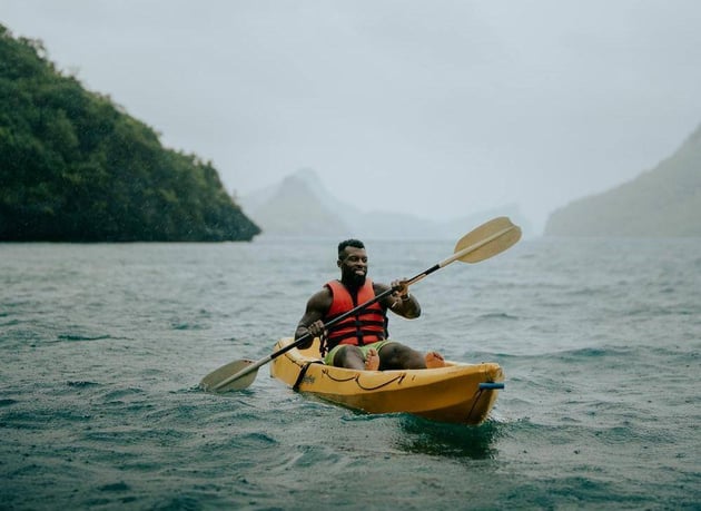 Man kayaking in Bali, one of the best places to travel in 2025.