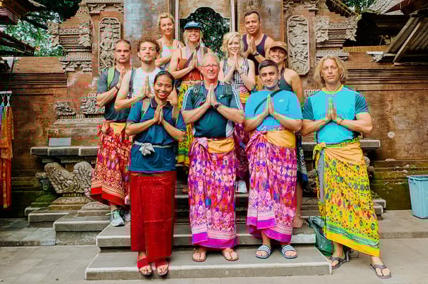 TrovaTrip Bali Group at Temple with hands in prayer