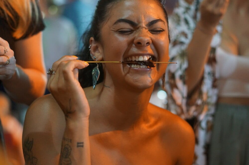 Person eating food while on a group trip