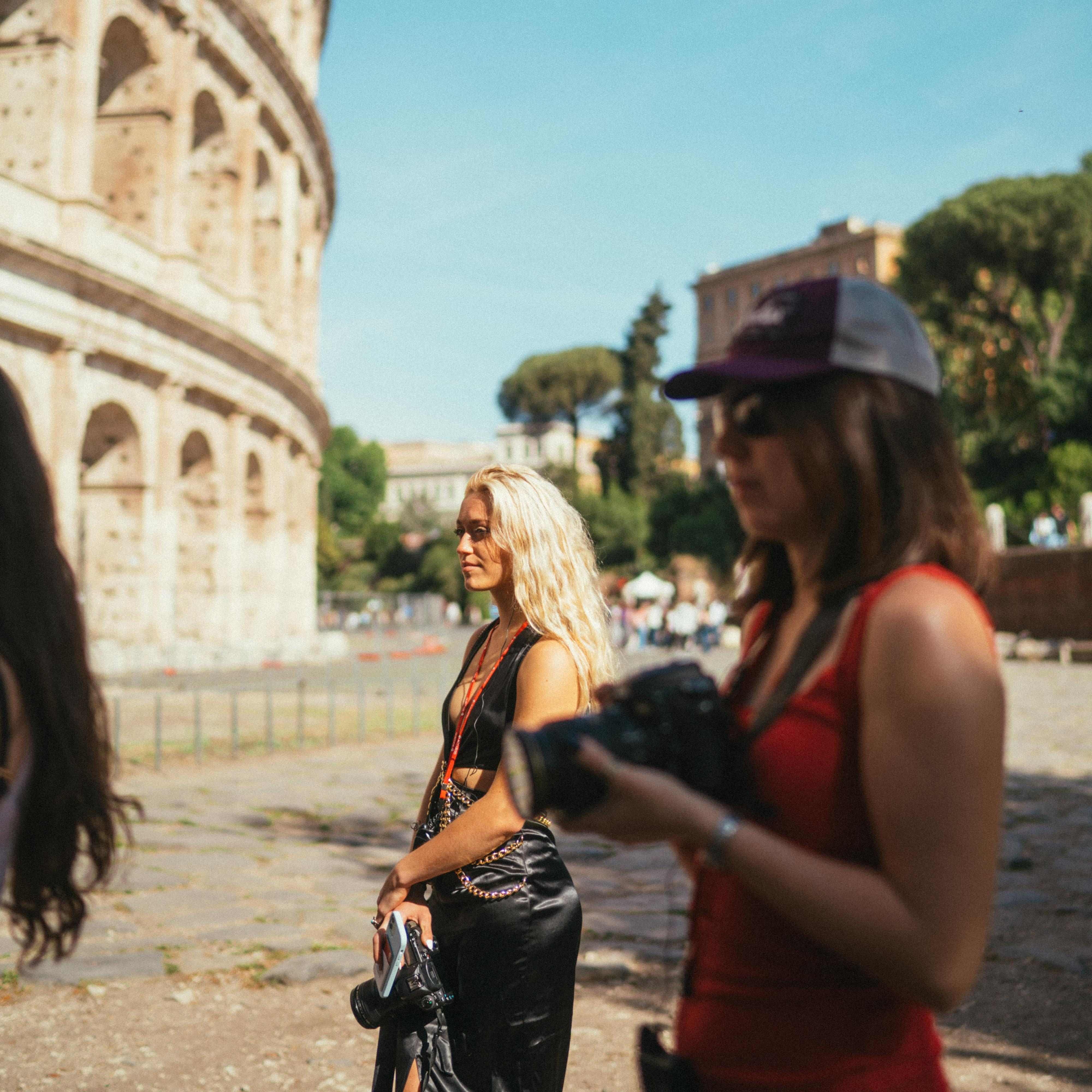 Traveler in Rome holding a camera.