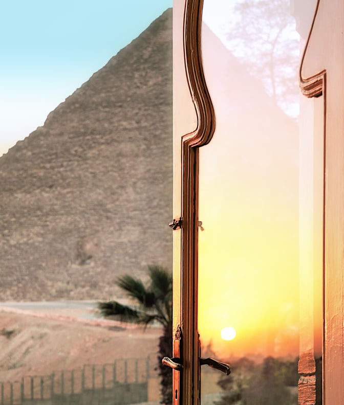 Rainbow sunset reflection on glass door in Egypt.