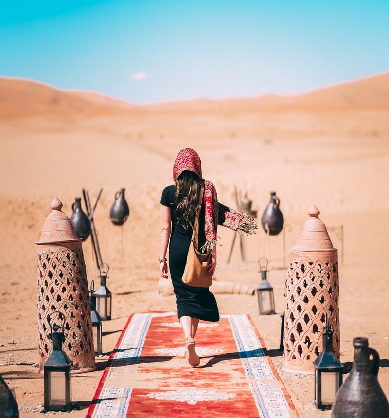 Person walking in desert camp in Egypt.