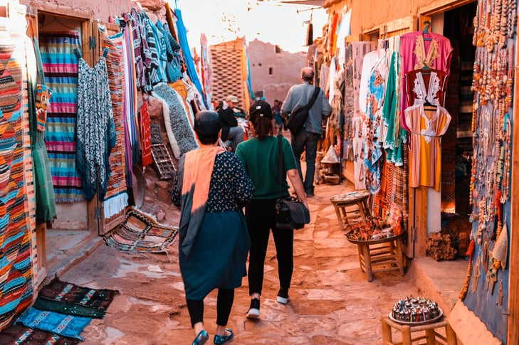 People walking through market in Morocco.