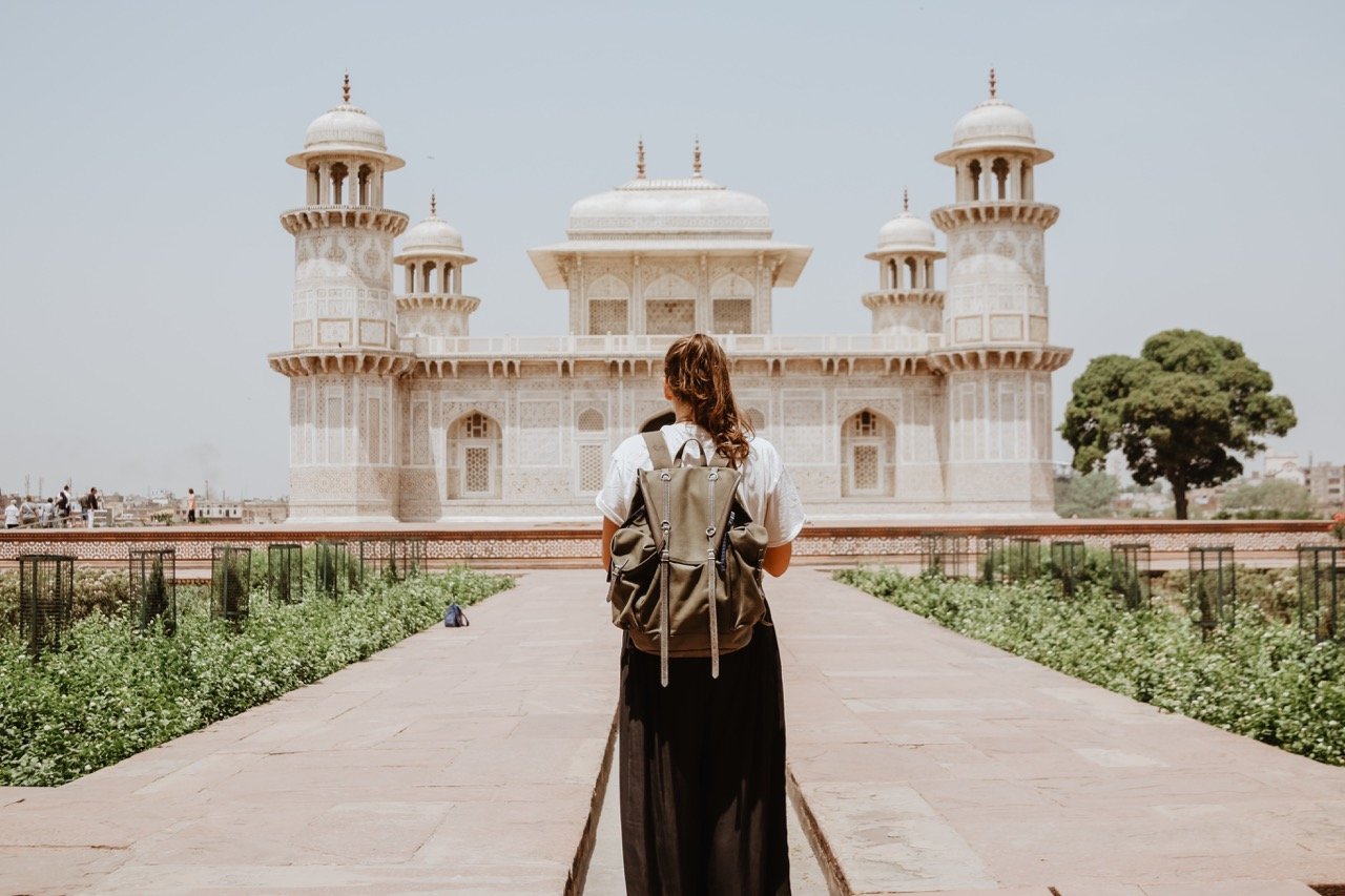 Person in front of a palace in Morocco.