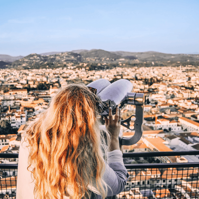 TrovaTrip Host Helene Sula viewing Florence, Italy cityscape.