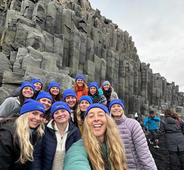 Trova Travelers at Reynisfjara Black Sand Beach in Iceland, one of the top 5 destinations for an outdoorsy girls trip.