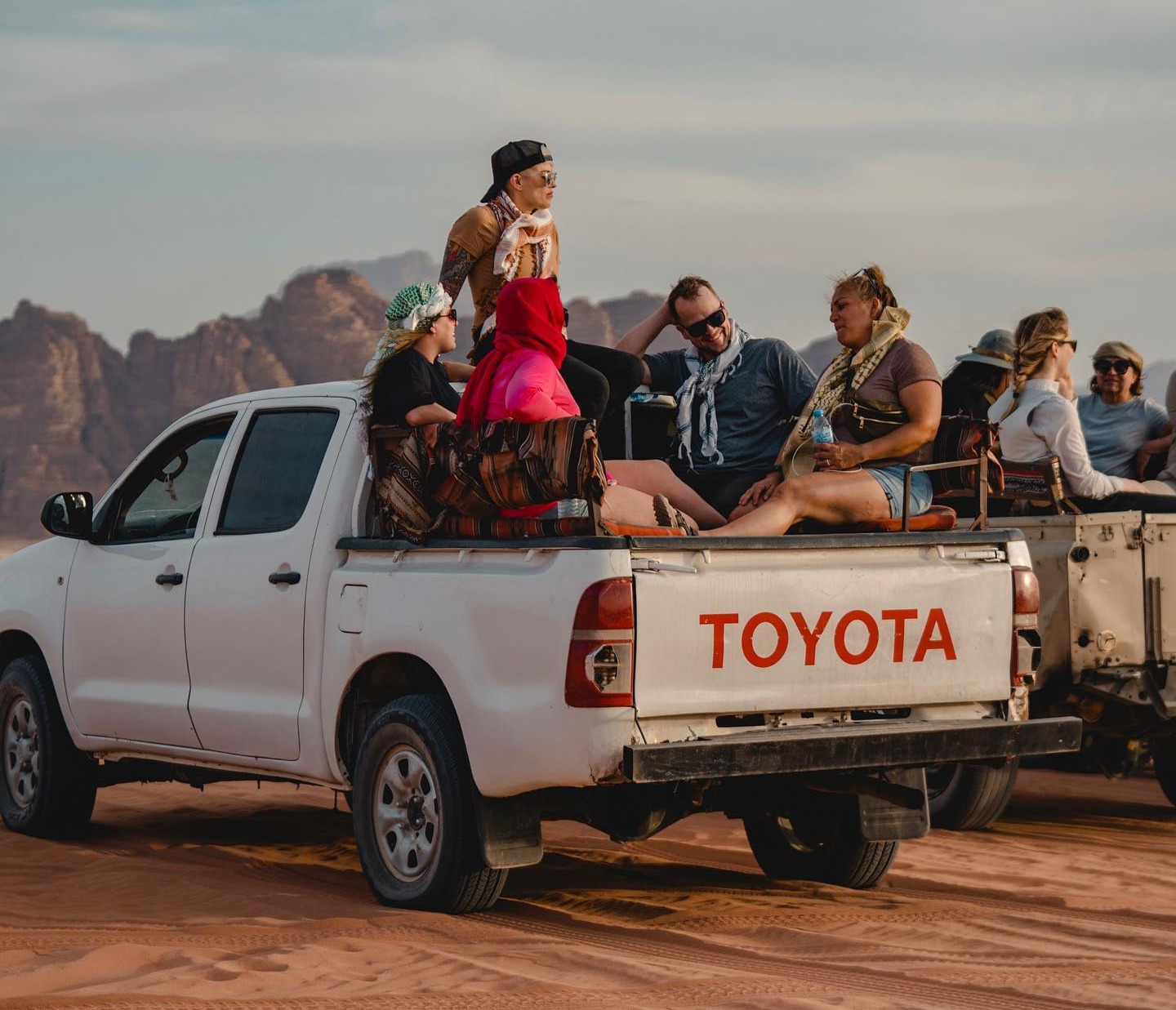 TrovaTrip group riding in truck in Jordan on trip with Krissy Harclerode.