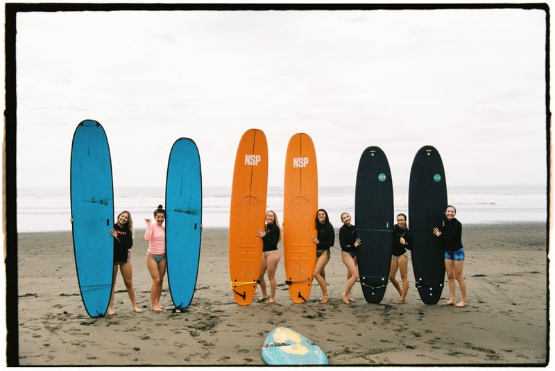 Travelers surfing on beaches of Costa Rica.
