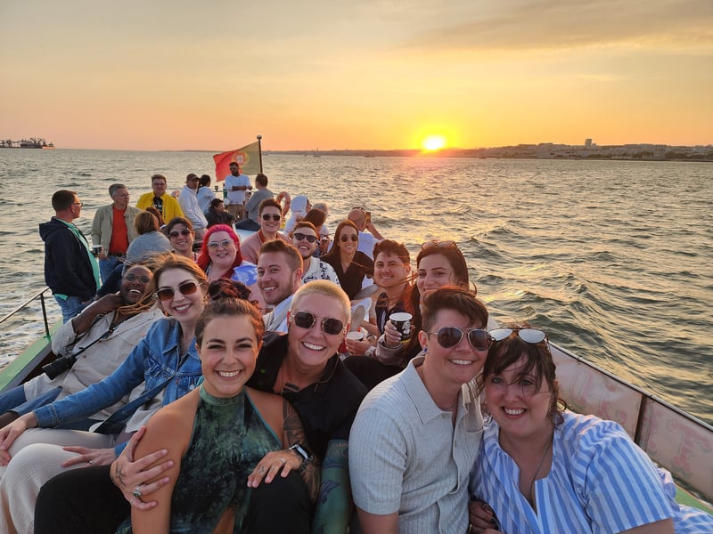 Luke and Kelsey Pearson in Portugal on sunset boat ride with Travelers.