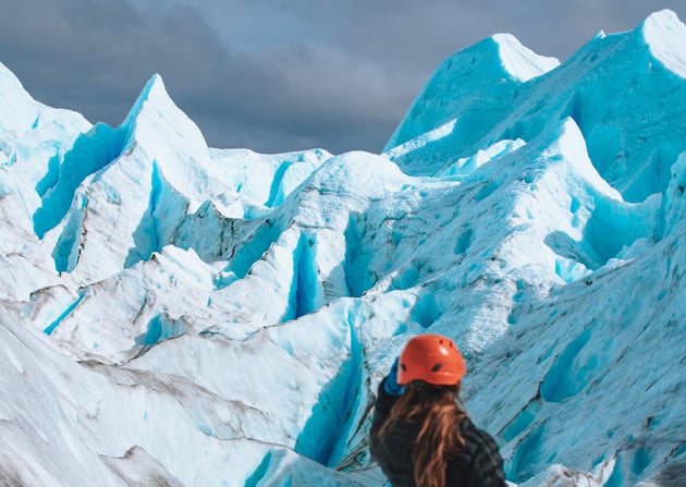 Woman hiking through Perito Moreno Glacier Ice Trek, a great destination for solo travel for women.