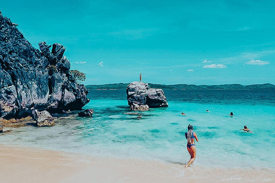 TrovaTrip Philippines girl on beach standing in ocean