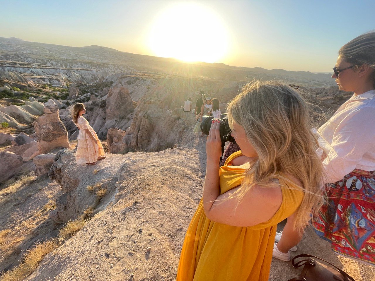 Travel influencer having photo taken in Cappadoccia, Turkey.