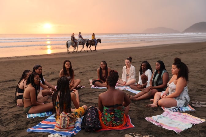 People speaking during a wellness retreat in Costa Rica.