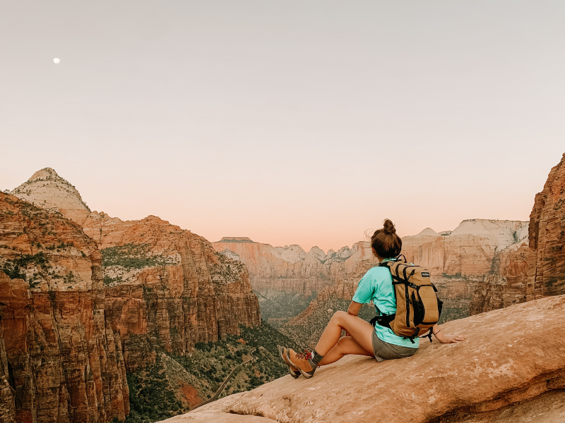 Hiker sitting enjoying view in Zion.