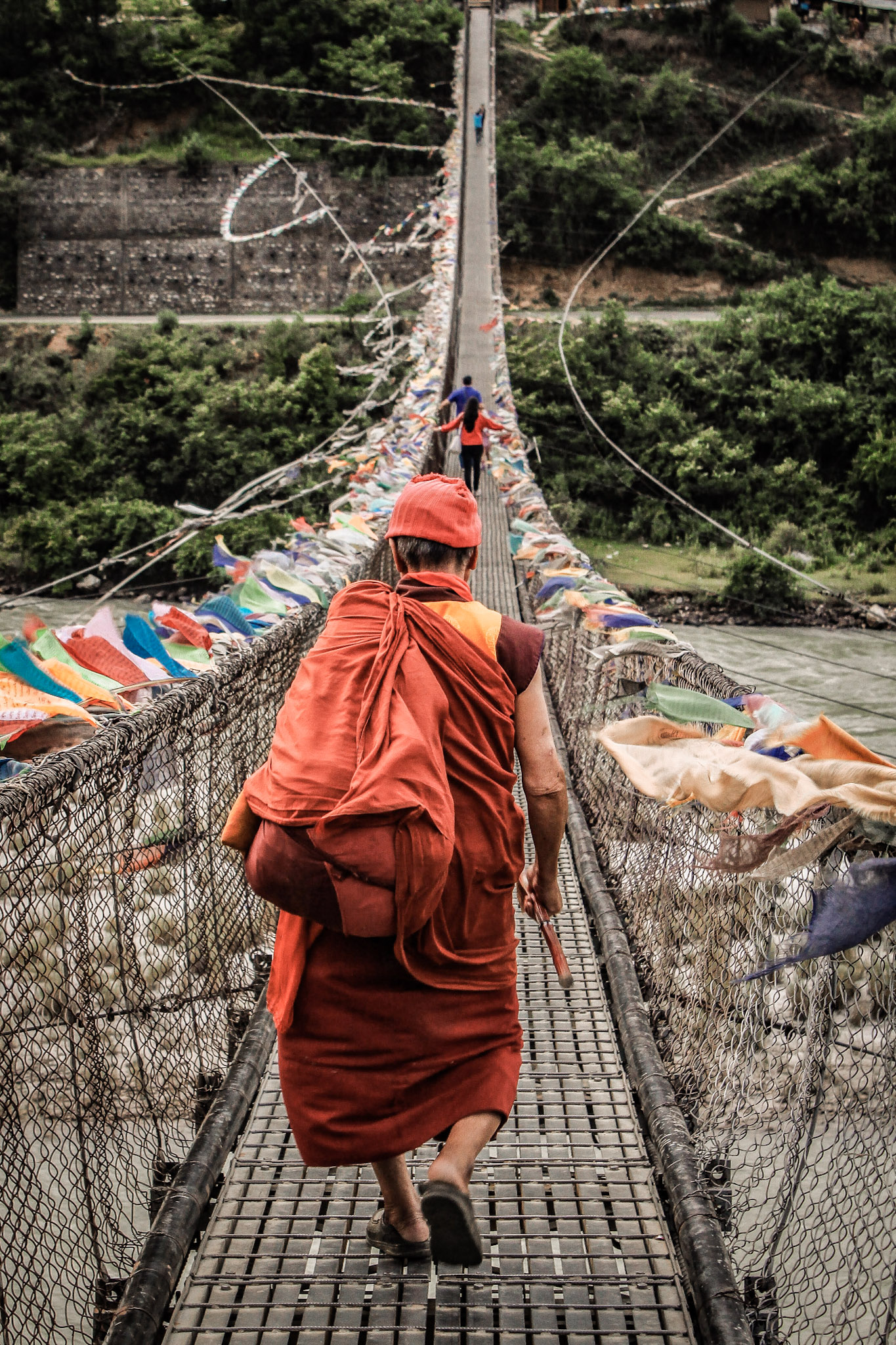 Monk-Crossing-Bridge-Bhutan