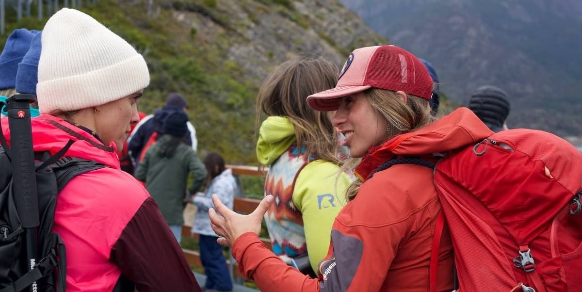 Pilar, a hiking Guide in Patagonia, talking to a Traveler on a group women's hiking trip