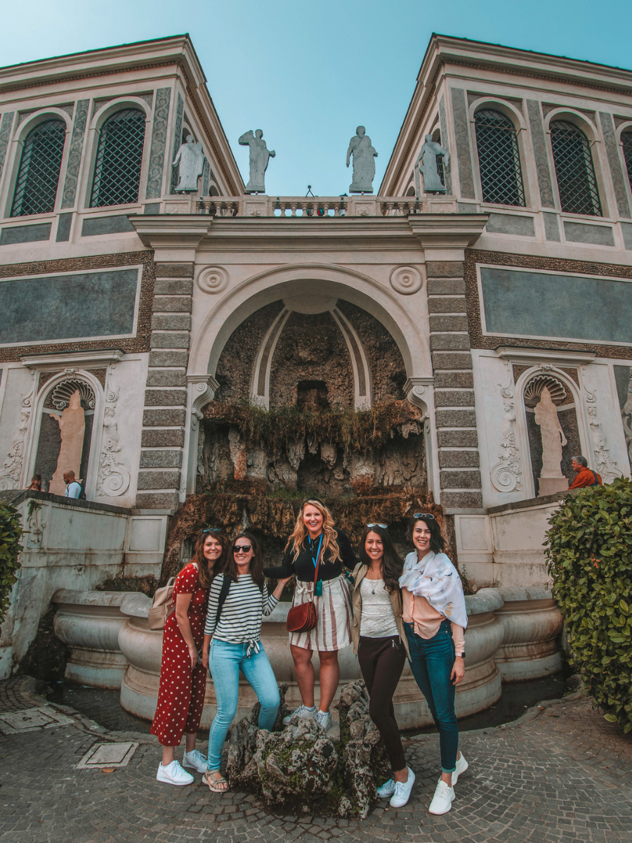 Helene Sula and her Travelers posing near fountain on her Italy TrovaTrip.